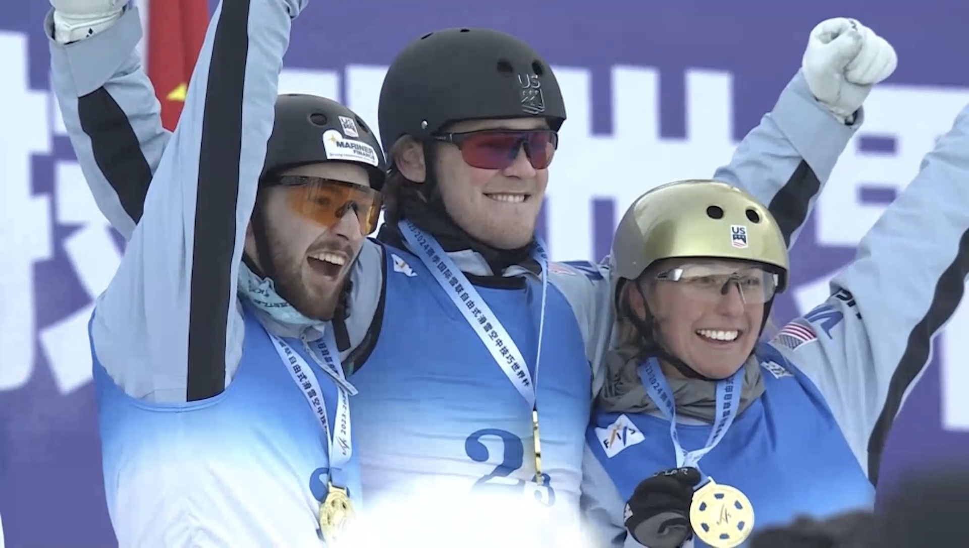 Winter Vinecki, Chris Lillis and Quinn Dehlinger atop the podium in the mixed aerials team event in Changchun, China. 