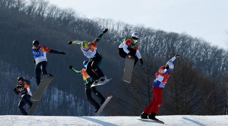 Nick Baumgartner (blue) and Mick Dierdorff (black) compete in the snowboardcross big final Thursday. (Getty Images - David Ramos)