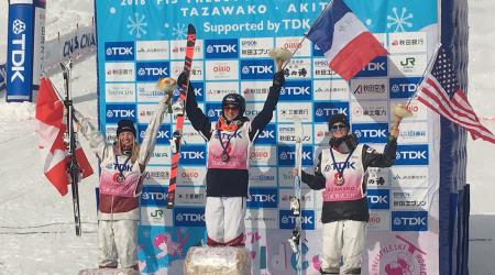 Keaton McCargo (right) celebrates her second career World Cup podium, a third place finish, with winner Perinne Laffont of France and second-place Justine Dufour-LaPointe of Canada.