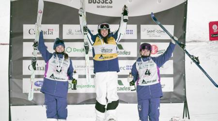 Jaelin Kauf and Olivia Giaccio stand on the dual moguls podium in Val St. Côme, Canada