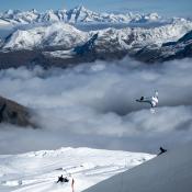 A snowboarder airs out of the halfpipe in Saas Fee. 